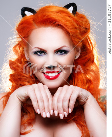 Portrait of beautiful red-haired woman 31193717