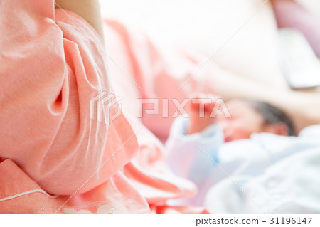 Baby breastfeeding with baby just after birth Mother born fetus infant baby girls private room baby baby blur 31196147