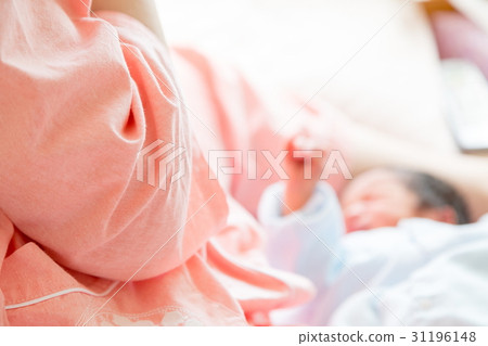 Baby breastfeeding with baby just after birth Mother born fetus infant baby girls private room baby baby blur 31196148
