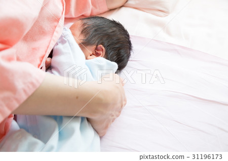 Baby breastfeeding with baby just after birth Mother born fetus infant baby girls private room baby baby blur 31196173