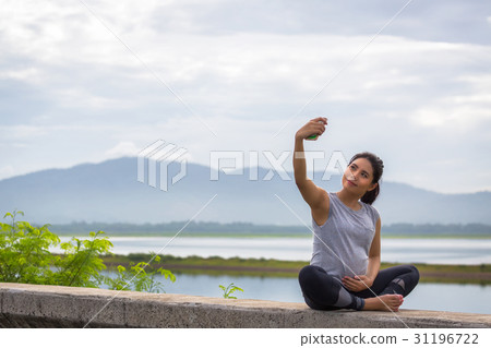 Pregnant woman taking selfie Pregnant woman taking selfie 31196722