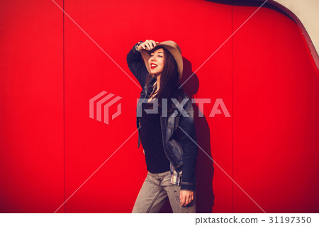 Smiling trendy model posing 31197350