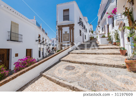 Charming narrow historic streets of Frigiliana. 31197609