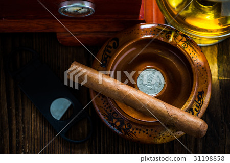 Cuban cigar in ashtray with cognac ad humidor 31198858