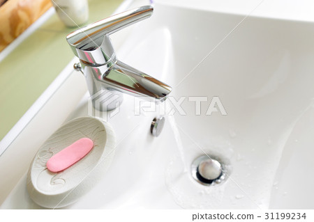 Working mixer tap in the bathroom closeup Working mixer tap in the bathroom closeup 31199234