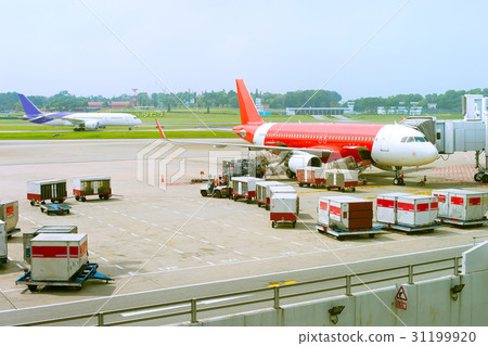 Plane loading at airport Plane loading at airport 31199920