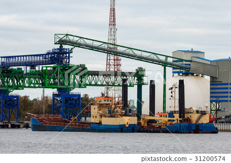 Blue cargo ship loading 31200574