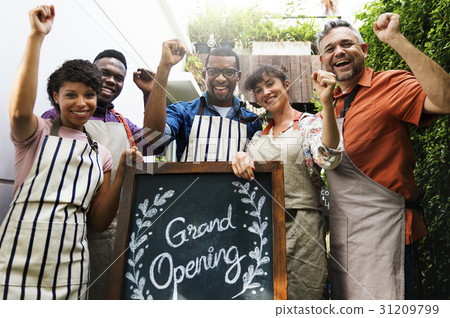 Group of friends with grand opening board together 31209799