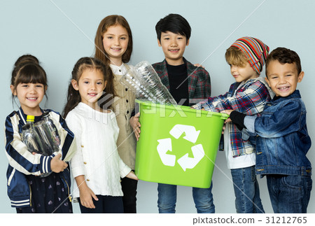 Kids and plastic bottles in a recycle bin Kids and plastic bottles in a recycle bin 31212765
