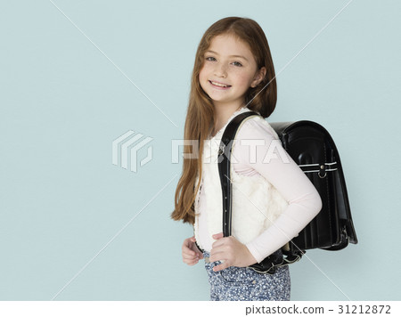 Young freckled girl carrying a backpack smiling portrait Young freckled girl carrying a backpack smiling portrait 31212872