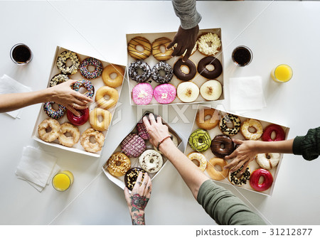 People Hands Reach Our Grabbing Doughnut People Hands Reach Our Grabbing Doughnut 31212877