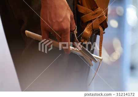 Hands with hair stylist scissors Hands with hair stylist scissors 31214172