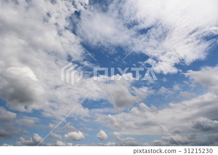 Blue sky in cloudy skies, early June 31215230