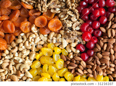 dried fruits and nuts on black background dried fruits and nuts on black background 31216107