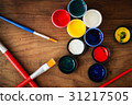 watercolors and brushes on wooden background 31217505
