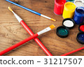 watercolors and brushes on wooden background 31217507