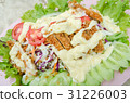 Chicken salad with pieces on top of lettuce 31226003