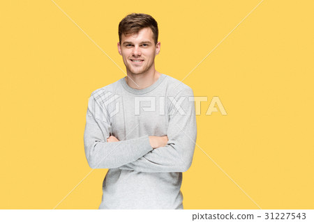 The young man smiling and looking at camera The young man smiling and looking at camera 31227543