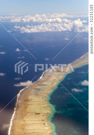 Polynesia. The atoll in ocean through clouds. Aeri 31231185