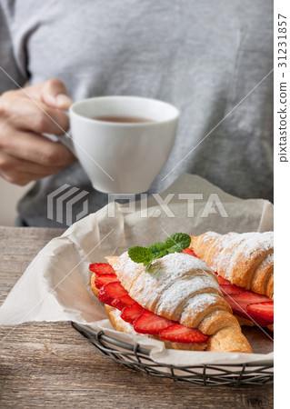 croissant with fresh strawberries, ricotta 31231857