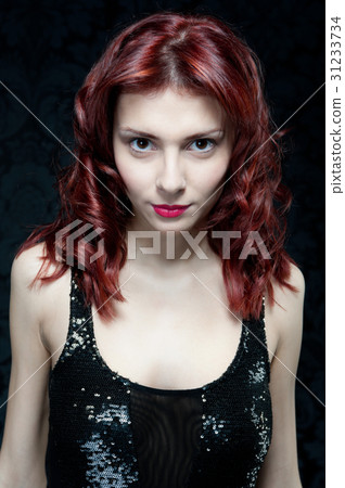 beautiful woman with red hair and black top beautiful woman with red hair and black top 31233734