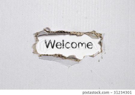 The word welcome appearing behind torn paper. 31234301