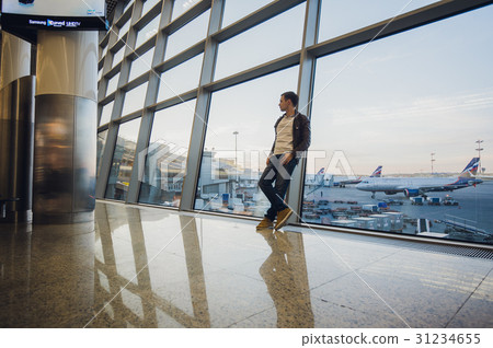 Portrait of an attractive young man walking and Portrait of an attractive young man walking and 31234655