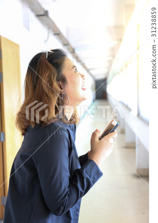 woman is very happy with smart phone on hands 31238859