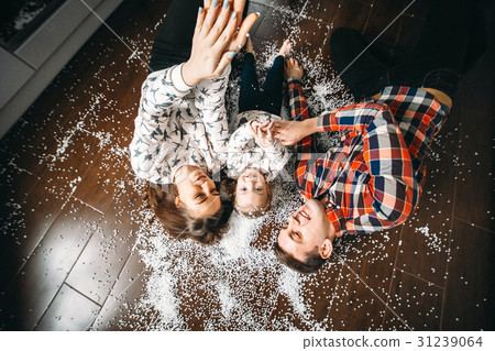 Happy family playing together on the floor 31239064