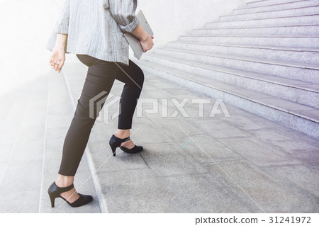 Business woman steps walking at outdoor stair Business woman steps walking at outdoor stair 31241972
