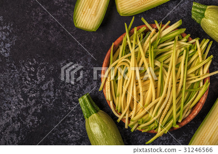 Raw zucchini pasta on dark background. 31246566
