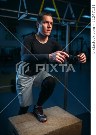 Athlete on training, endurance exercise with box 31247131