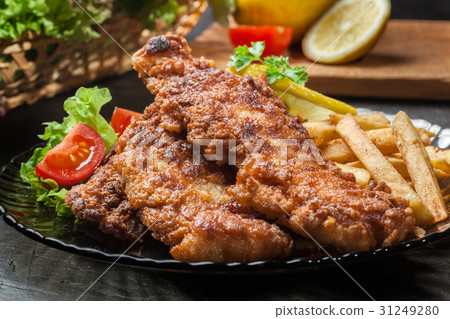 Fried fish in crispy batter with chips Fried fish in crispy batter with chips 31249280
