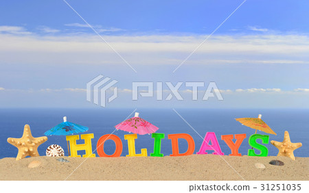Holidays letters on a beach sand Holidays letters on a beach sand 31251035