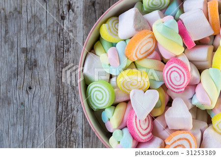 Closeup of colorful mini marshmallows with candy Closeup of colorful mini marshmallows with candy 31253389