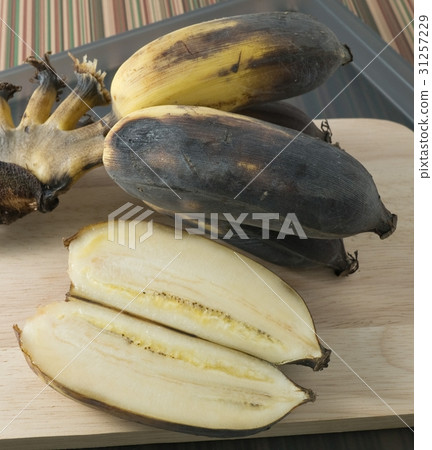 Bunch of Old Banana Fruit on A Wooden Board 31257229