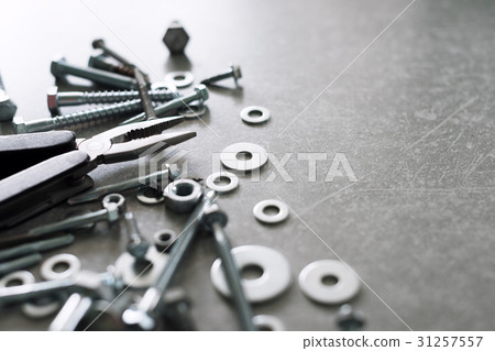 Construction tools. The screws, nuts and bolts 31257557