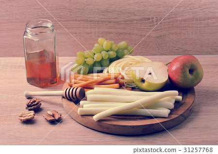 various types of cheese Suluguni cheese and a jar of honey various types of cheese Suluguni cheese and a jar of honey 31257768