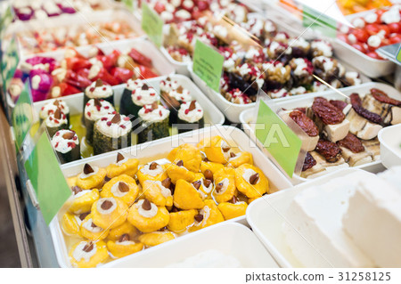 Assorted marinated vegetables and olives on farmer 31258125