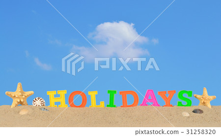 Holidays letters on a beach sand 31258320