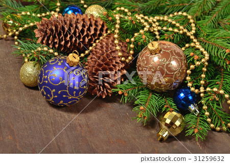Christmas decorations and spruce branch and cones Christmas decorations and spruce branch and cones 31259632