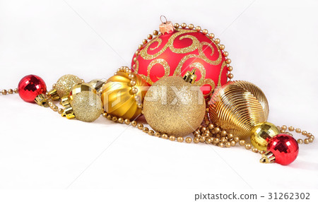 Golden and red Christmas decorations on a white Golden and red Christmas decorations on a white 31262302