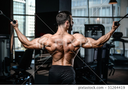 Handsome power athletic man diet training pumping up back muscle 31264419