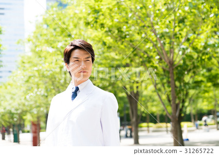 A young man in a white coat A young man in a white coat 31265722
