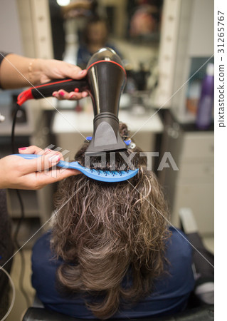 Styling female hair dryer 31265767