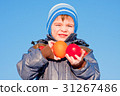 little boy with  fruit in hands 31267486