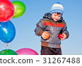 little boy with air marbles and fruit in hands 31267488