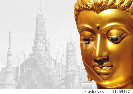 The golden face of the old Buddha statue. 31269457