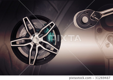 Double exposure. Repairing wheel concept. Double exposure. Repairing wheel concept. 31269487