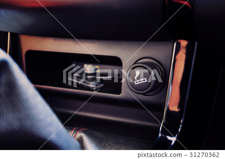 The Car cigarette lighter in a car interior. 31270362